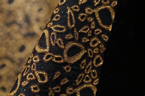 black metallic gold fabric|fabric with gold metallic threads.